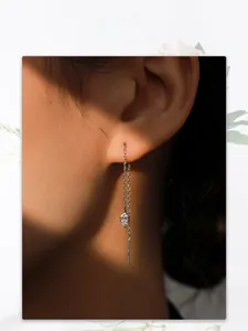 Detail of S925 silver threader earring with sparkling marquise cut cubic zirconia stone