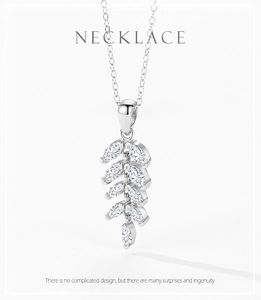 Macro detail of S925 silver leaf pendant with sparkling marquise-cut zircon stones