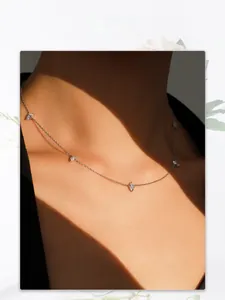 Close-up of S925 silver marquise-cut zircon choker necklace on a female model