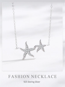 Close-up of S925 sterling silver double starfish necklace with micro-pave cubic zirconia