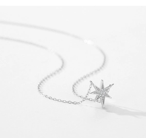 Close-up of S925 sterling silver star pendant with pavé-set shimmering cubic zirconia