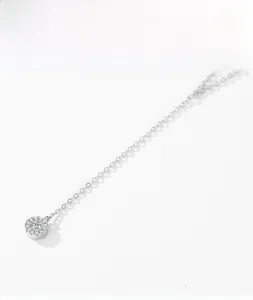 Detail of S925 silver round pendant necklace with zircon pavé on a thin chain