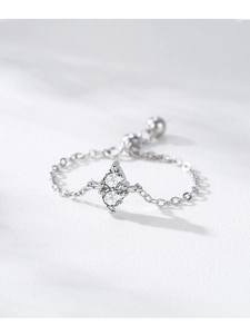 Macro detail of 925 silver adjustable chain ring with teardrop cubic zirconia settings