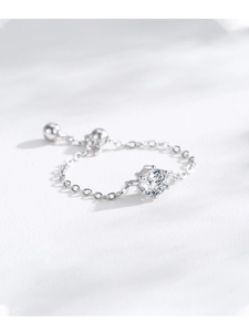 Detail of adjustable silver chain ring featuring a six-prong set brilliant round zircon