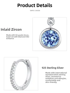 Detailed macro view of S925 sterling silver hoop earrings with blue zircon inlays