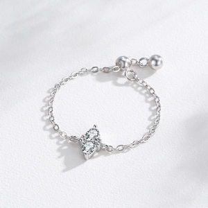 925 sterling silver chain ring featuring dual teardrop cubic zirconia on a white surface