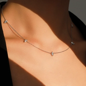 Elegant S925 sterling silver necklace with marquise cut stones on a female model