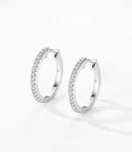 Macro shot of S925 sterling silver hoop earrings with micro-paved sparkling zircon stones