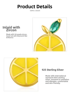 Detail of S925 sterling silver lemon earrings with yellow enamel and green zircons