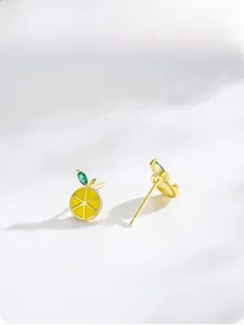 Macro shot of S925 sterling silver lemon studs featuring yellow enamel and S925 hallmark
