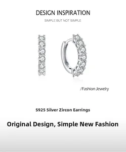 Détail macro du poinçon S925 en argent sterling et cristaux de zircone sur boucles d'oreilles