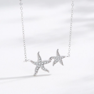 Elegant S925 sterling silver necklace featuring double starfish pendants with pavé zircons