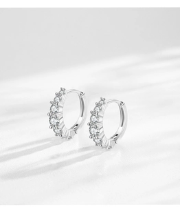 Macro detail of S925 sterling silver hoop earrings with sparkling round cubic zirconia