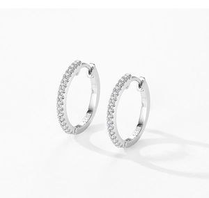 Macro shot of S925 sterling silver huggie earrings with micro-pave cubic zirconia