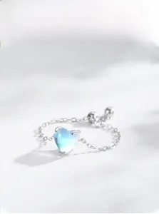 Detail of adjustable S925 sterling silver chain ring with heart-shaped moonstone gem