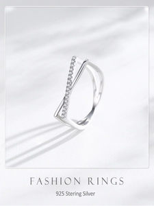 Macro view showing 925 sterling silver criss cross ring with sparkling zircon stones