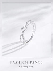 Macro shot of S925 sterling silver crisscross ring with pavé cubic zirconia accents