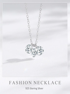 Detail of S925 sterling silver necklace with three sparkling round zirconia stones
