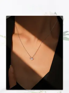 Close-up of S925 sterling silver necklace with a sparkling solitaire round cut pendant