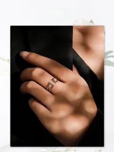 Close-up of geometric S925 silver open ring with micro-set diamonds on model hand