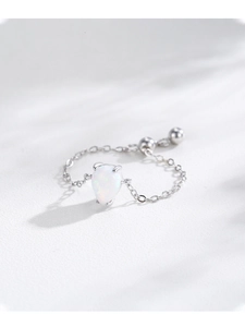 Detail of adjustable S925 silver chain ring with teardrop opal and bead sliders