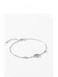 Macro shot of S925 silver hollow heart charm bracelet with pavé cubic zirconia details
