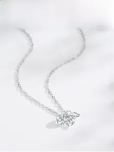 Detail of S925 sterling silver necklace with three round brilliant-cut sparkling zircons