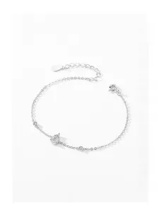 Detail of S925 sterling silver chain with micro-set heart charm and cubic zirconia stones
