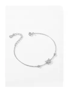 Close-up of S925 sterling silver bracelet with micro-pave butterfly and hallmark