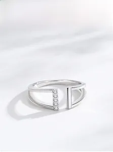 Close-up of S925 silver double-layer open ring with vertical row of five micro-set diamonds