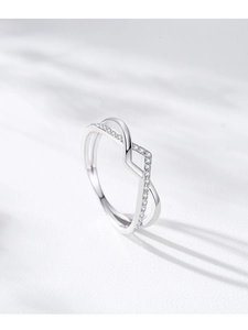 Detail shot of crisscross S925 silver ring with pavé-set sparkling cubic zirconia