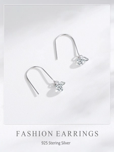 Macro shot of 925 sterling silver ear hooks with cluster-set marquise cubic zirconia
