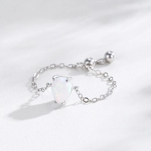 Adjustable S925 sterling silver chain ring with pear-shaped white opal and four-prong setting