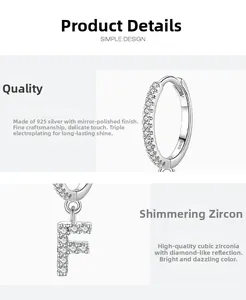 Close-up of S925 sterling silver letter F earring with pavé cubic zirconia detail