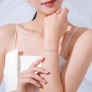 Elegant S925 sterling silver heart bracelet with cubic zirconia pavé on model's wrist