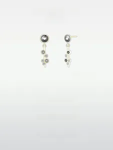Macro shot of gold S925 silver earrings with black enamel inlay and cubic zirconia stones