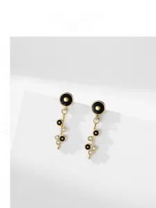 Close-up of S925 silver earrings with black enamel rings and micro-set cubic zirconia
