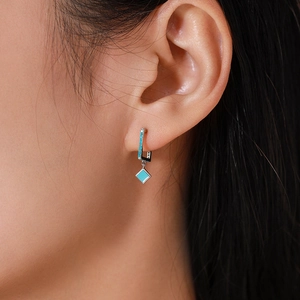 Elegant S925 sterling silver hoop earrings with turquoise rhombus pendants on model