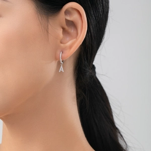 Sparkling S925 sterling silver letter A hoop earring with pavé zircon stones on model