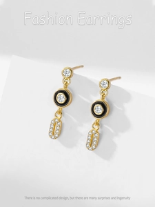 Macro shot of S925 silver earrings with black enamel and micro-paved cubic zirconia