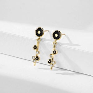 Elegant gold drop earrings with black enamel circles and micro-pave cubic zirconia