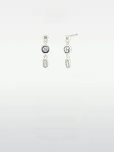 Close-up of S925 silver earrings with black enamel geometric shapes and micro-pave crystals