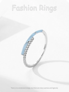 Close-up of S925 sterling silver stamp on blue enamel and zircon crossover ring