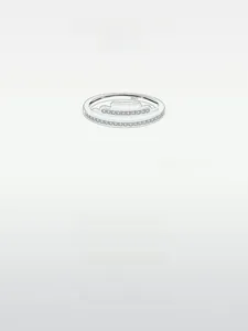 Macro shot of S925 sterling silver ring featuring double bands and cubic zirconia accents