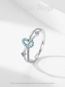 Macro view of crossover S925 silver ring with turquoise and purple zircon stones