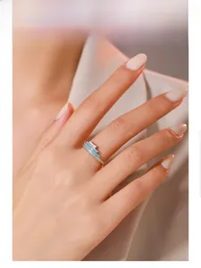 Model wearing a S925 silver ring with dopamine enamel bands and pave set crystals