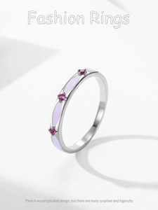 Detailed macro of S925 silver ring with purple enamel inlay and pink zircon gemstones