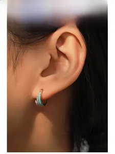 Model wearing S925 silver rainbow enamel U-shaped earrings with micro-set zircon
