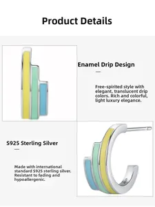 Macro shot of S925 sterling silver hoop earrings with yellow, green and blue enamel details