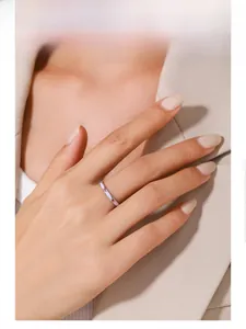 Model wearing a minimalist S925 silver ring with purple enamel and pink zircon stones